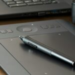 pen on gray e book reader