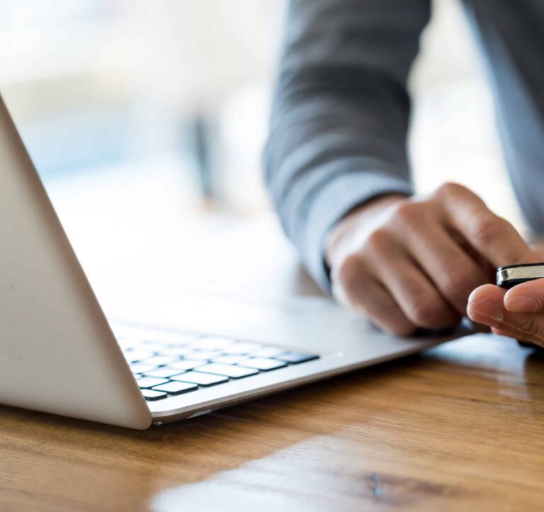 Person Playing with mobile phone & laptop