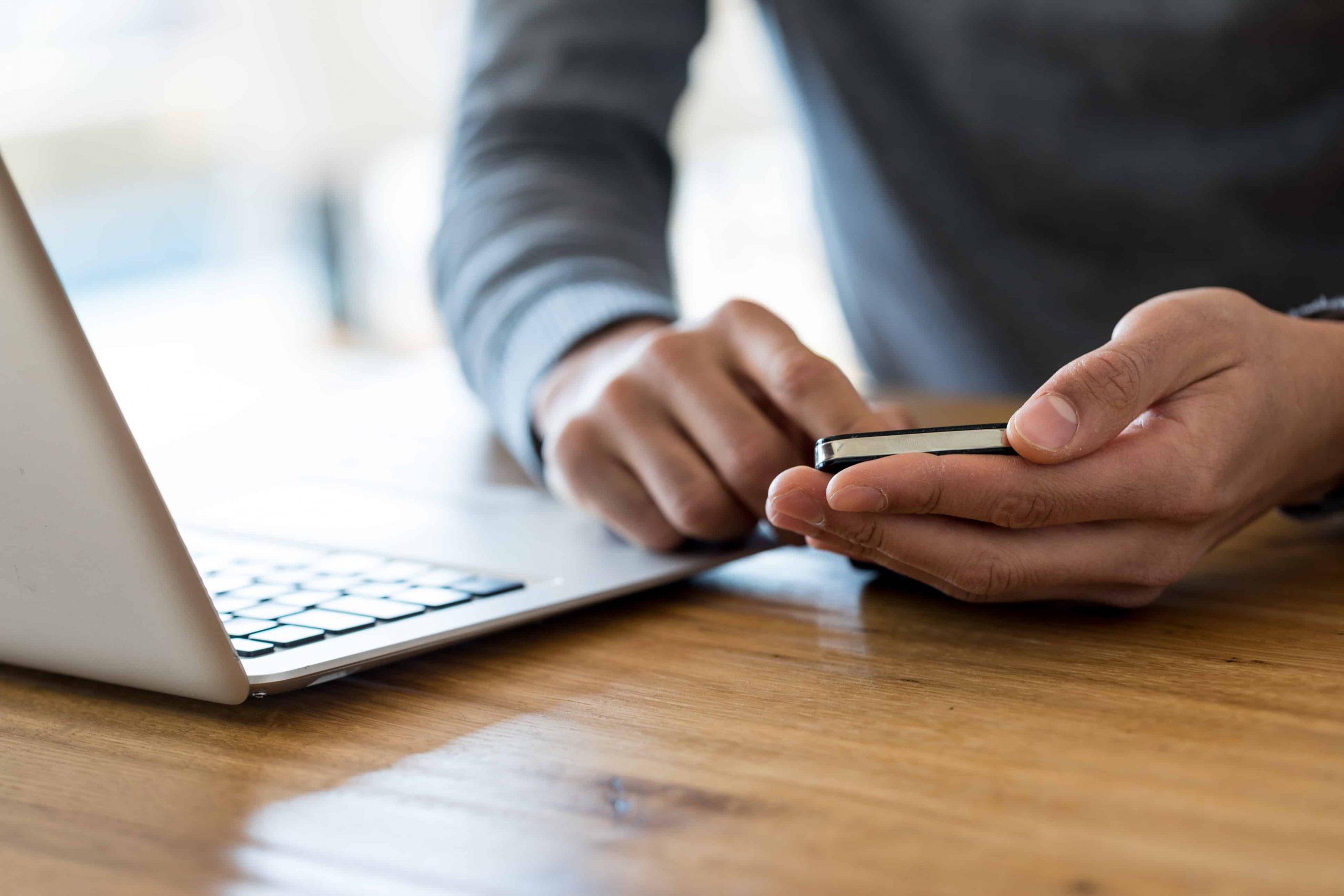 Person Playing with mobile phone & laptop